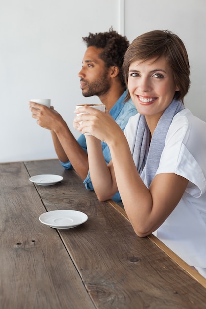 Casual friends having coffee together