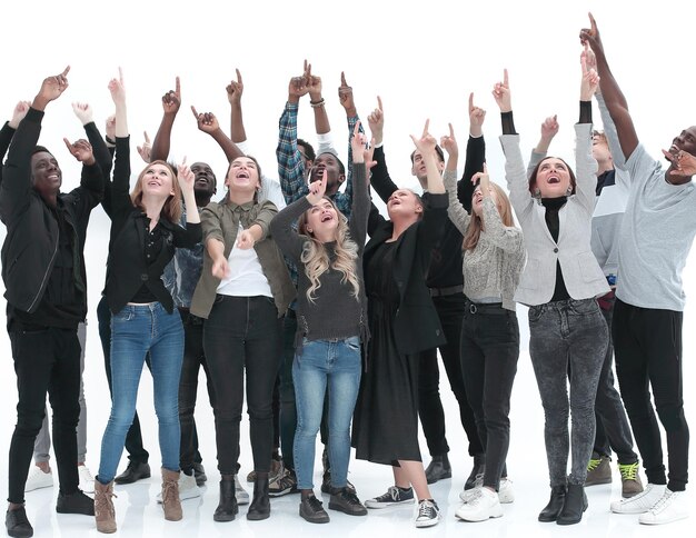 Casual group of excited friends with arms up isolated on\
white