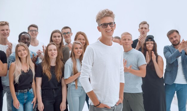 Casual guy standing in front of a group of young people