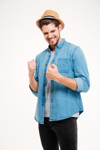 Casual handsome man rejoices isolated on the white background