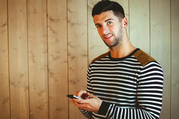 Casual hipster using his phone