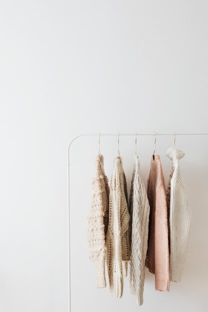 Photo casual knitted sweaters hanging on a rack