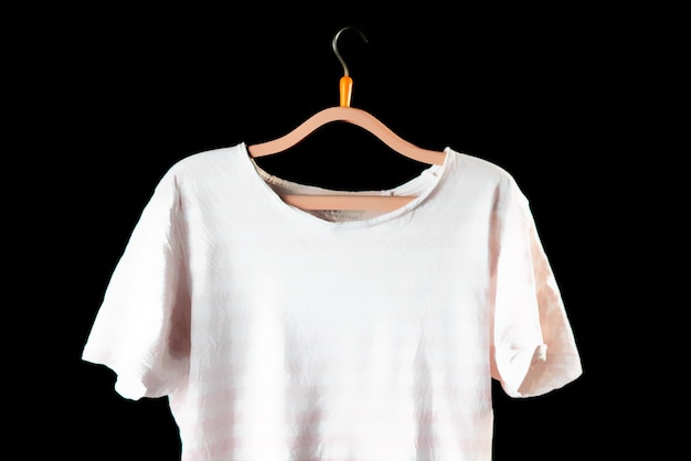 Photo casual men tshirt on a hanger on the dark background mockup copy spaces