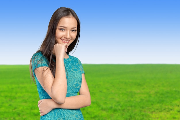 Casual mixed-race Asian Caucasian woman smiling looking happy