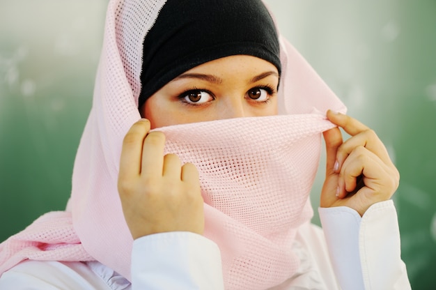 Casual Muslim Arabic student looking happy and smiling