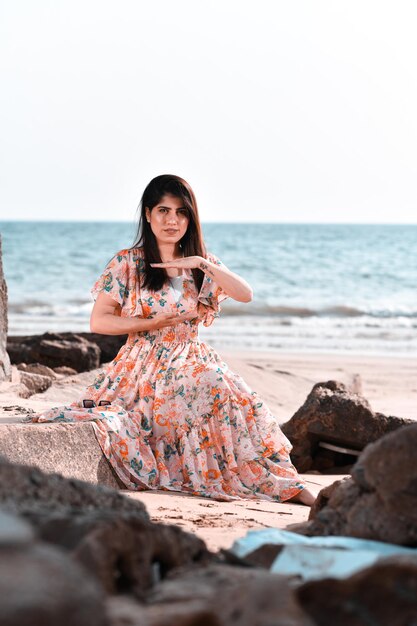 casual pretty girl front pose on beach indian pakistani model