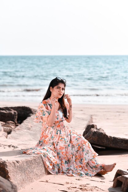 casual pretty girl front pose on beach indian pakistani model