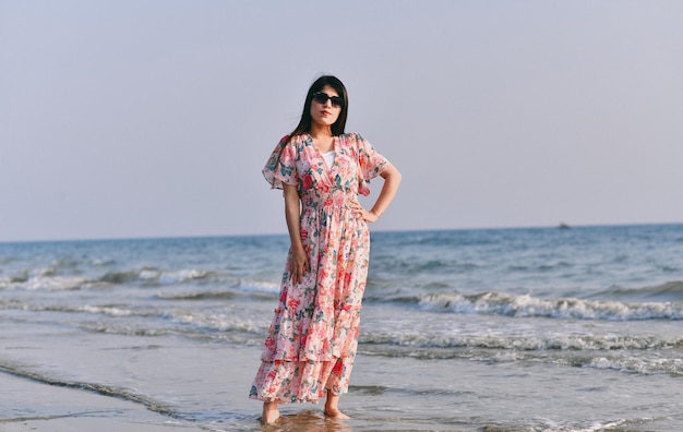 casual pretty girl front pose on beach indian pakistani model