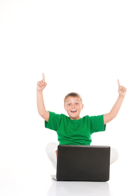 Casual teenager with laptop over white background