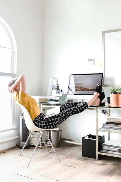 Casual woman planning a project in an office