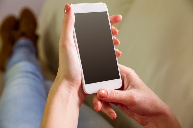 Casual woman using her smartphone