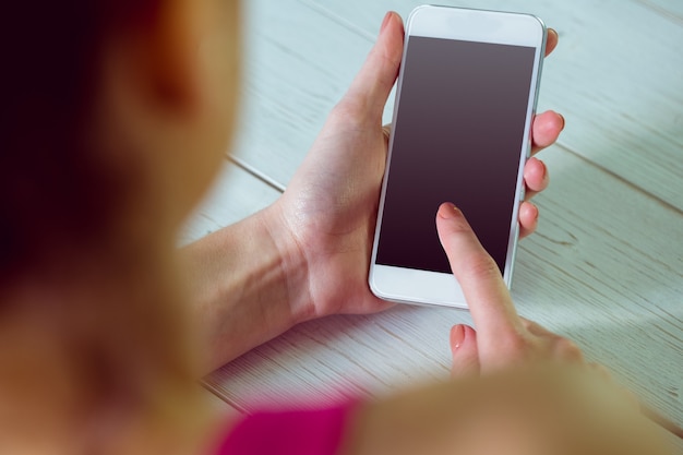 Casual woman using her smartphone