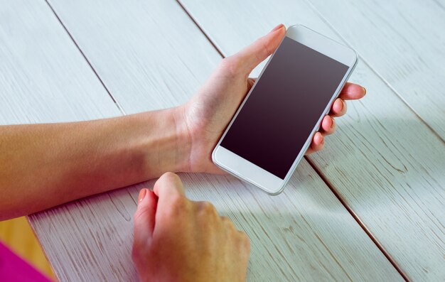 Casual woman using her smartphone