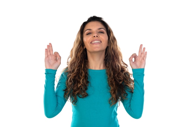 Casual woman with wavy and long hair isolated on a white wall