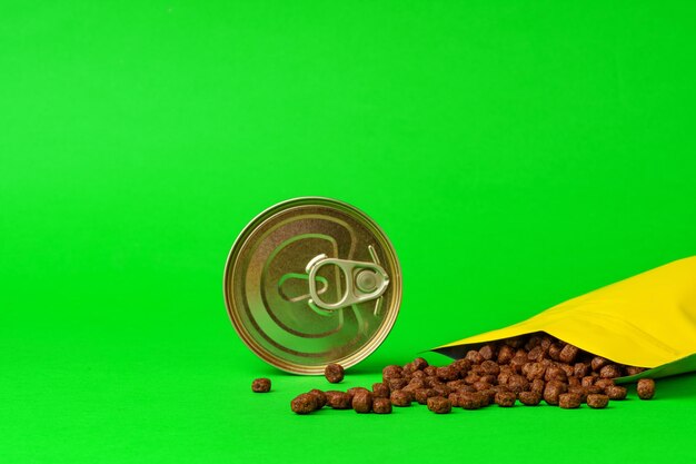 Photo cat food on green background in studio