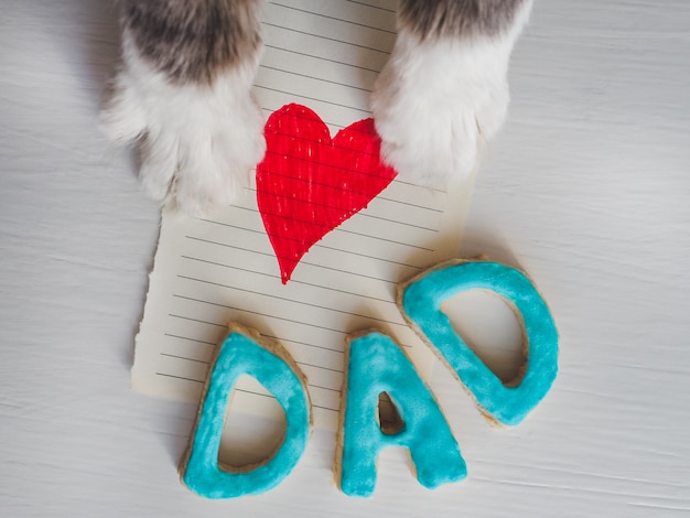 Cat&#39;s paws, greeting card and word DAD