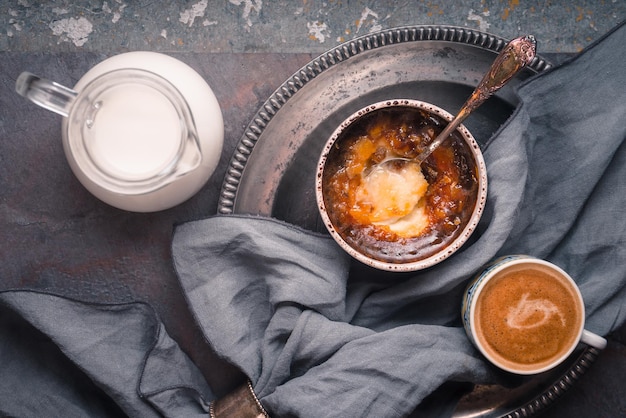 Catalan cream with cup of coffee on the stone background