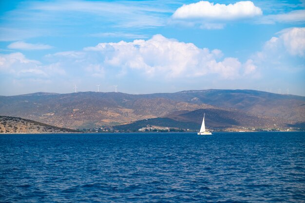 Catamaran sail yacht cruising on deep blue sea water