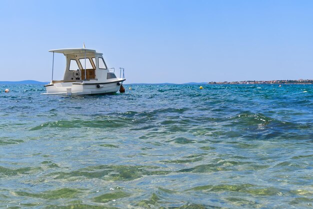 Catamaran sailing in ocean paradice at sea Blue sky and turquoise blue sea water