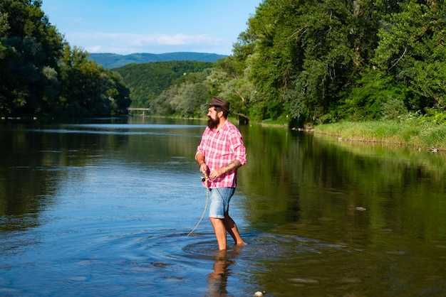 Catching and fishing united with nature rural getaway happy\
fisherman leisure fishing by the lake rest and recreation it is not\
sport it is obsession