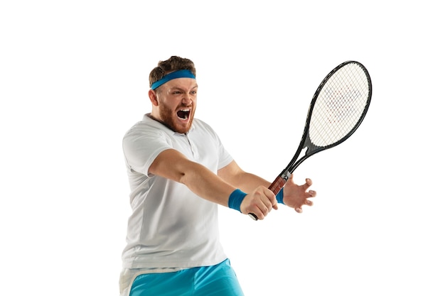 Catching. Highly tensioned game. Funny emotions of professional tennis player isolated on white studio background. Excitement in game, human emotions, facial expression and passion with sport concept.