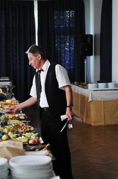 catering buffet food party preparation man