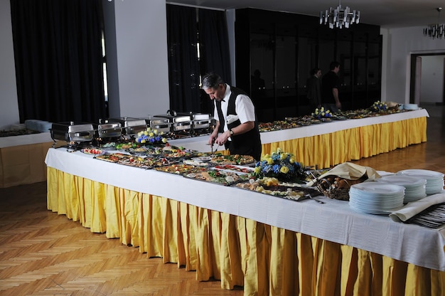 catering buffet food party preparation man