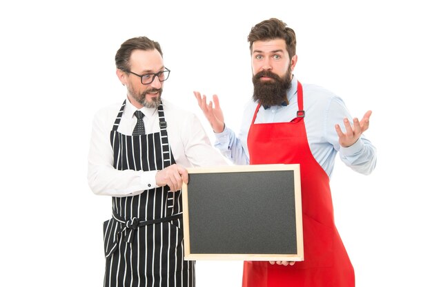 Catering business. welcome on board. cafe and restaurant opening. menu planning. happy chef team in apron. partners celebrate start up. bearded men with blackboard, copy space. Right nutrition.