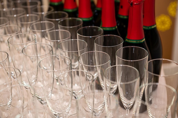 Catering services rows of shampagne glasses at restaurant party or celebration closeup