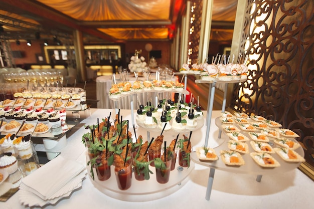 Catering table buffet dinner beautifully decorated banquet with variety of different food snacks