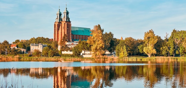 Cathedral in Gniezno town, Poland, on a bright day in Summer with reflection