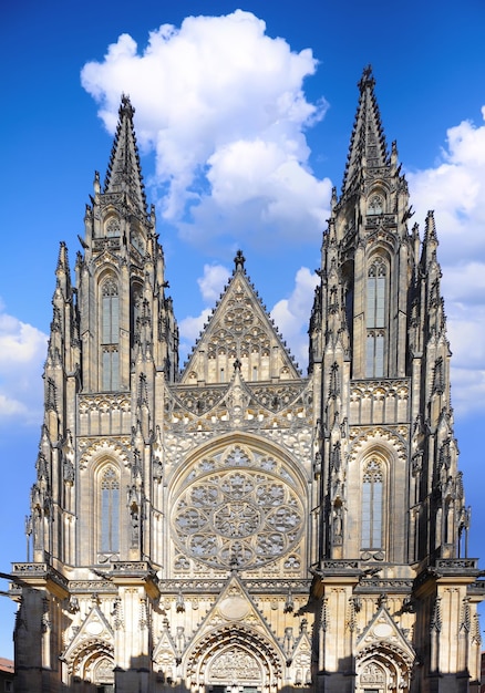 A cathedral with a large tower and a large window with the word vitus on it.