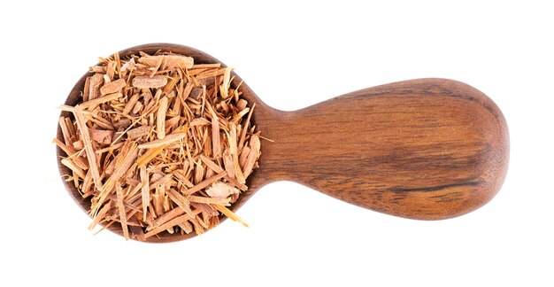 Catuaba bark in wooden bowl isolated on white background Trichilia catigua bark Chuchuhuasha Tatuaba Pau de Reposta Piratancara and Caramuru Top view