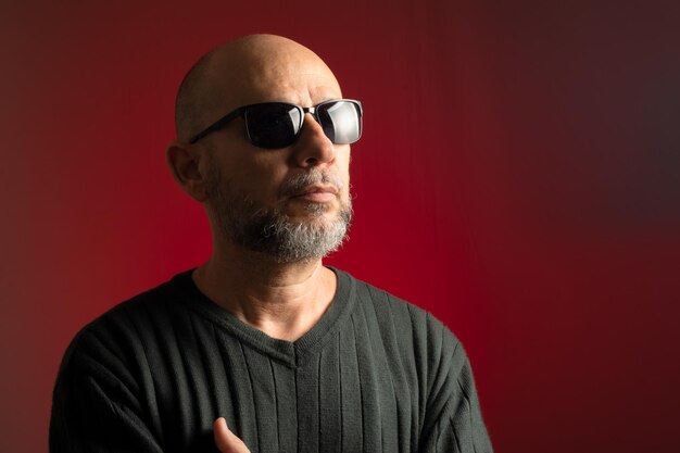 Caucasian bald man in sunglasses confident looking up