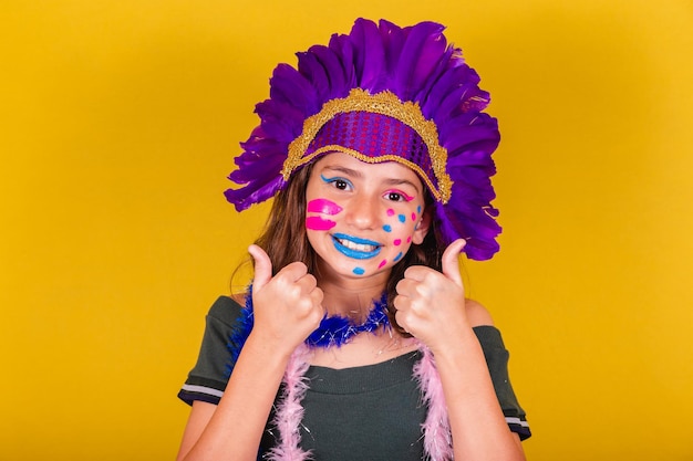 Caucasian brazilian child dressed for carnival Thumb up affirmative approval confirmation