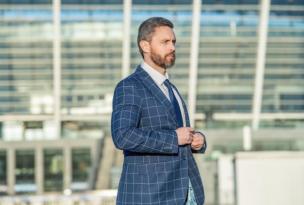 Caucasian business executive on urban background business executive wearing jacket