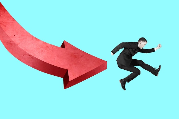 Photo caucasian businessman running away from falling 3d red arrow