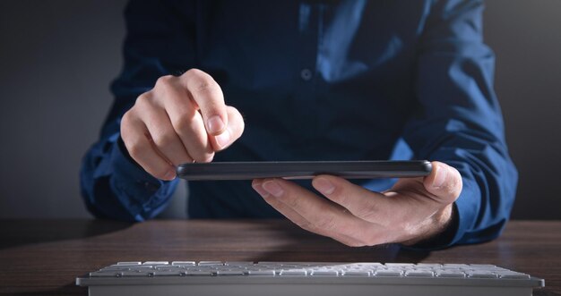 Caucasian businessman using smartphone at office