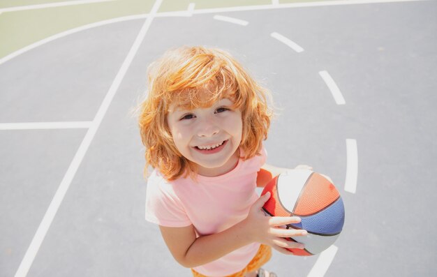 Caucasian child play basketball portrait Kids face
