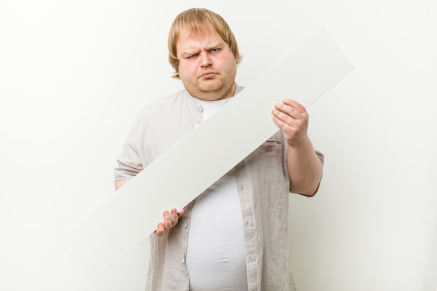 Caucasian crazy blond man with a placard