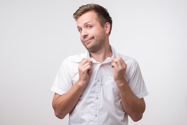 Caucasian cute smiling man poting Joyful and playful behavior