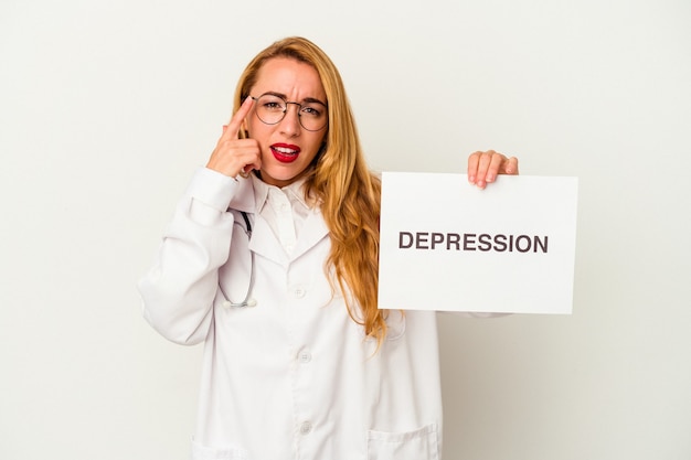 Caucasian doctor woman holding a depression placard isolated on white background showing a disappointment gesture with forefinger.