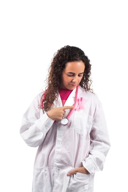 Caucasian doctor woman with pink stethoscope with breast cancer pink ribbon.
