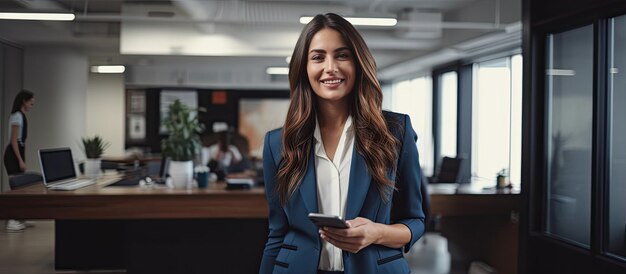 A caucasian female businesswoman happily makes a call in her office