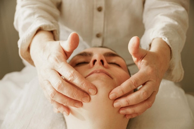 Caucasian female enjoying her facial massage