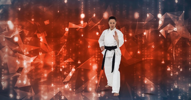 Photo caucasian female martial artist with black belt against plexus networks on blue background