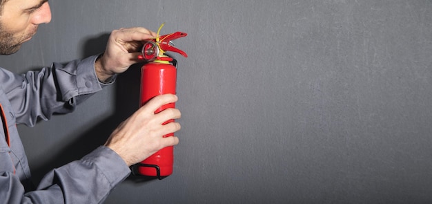 Caucasian fireman holding fire extinguisher