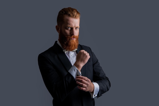 Caucasian gentleman wearing elegant tuxedo tuxedo fashion handsome bearded gentleman in tuxedo isolated on grey background gentleman studio shot in tuxedo