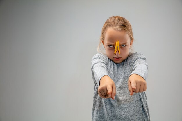 Caucasian girl wearing the respiratory protection pin clasp against air pollution