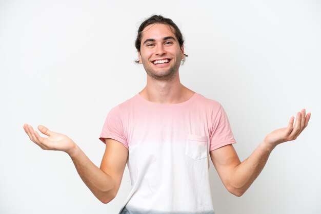 Caucasian handsome man isolated on white background with shocked facial expression